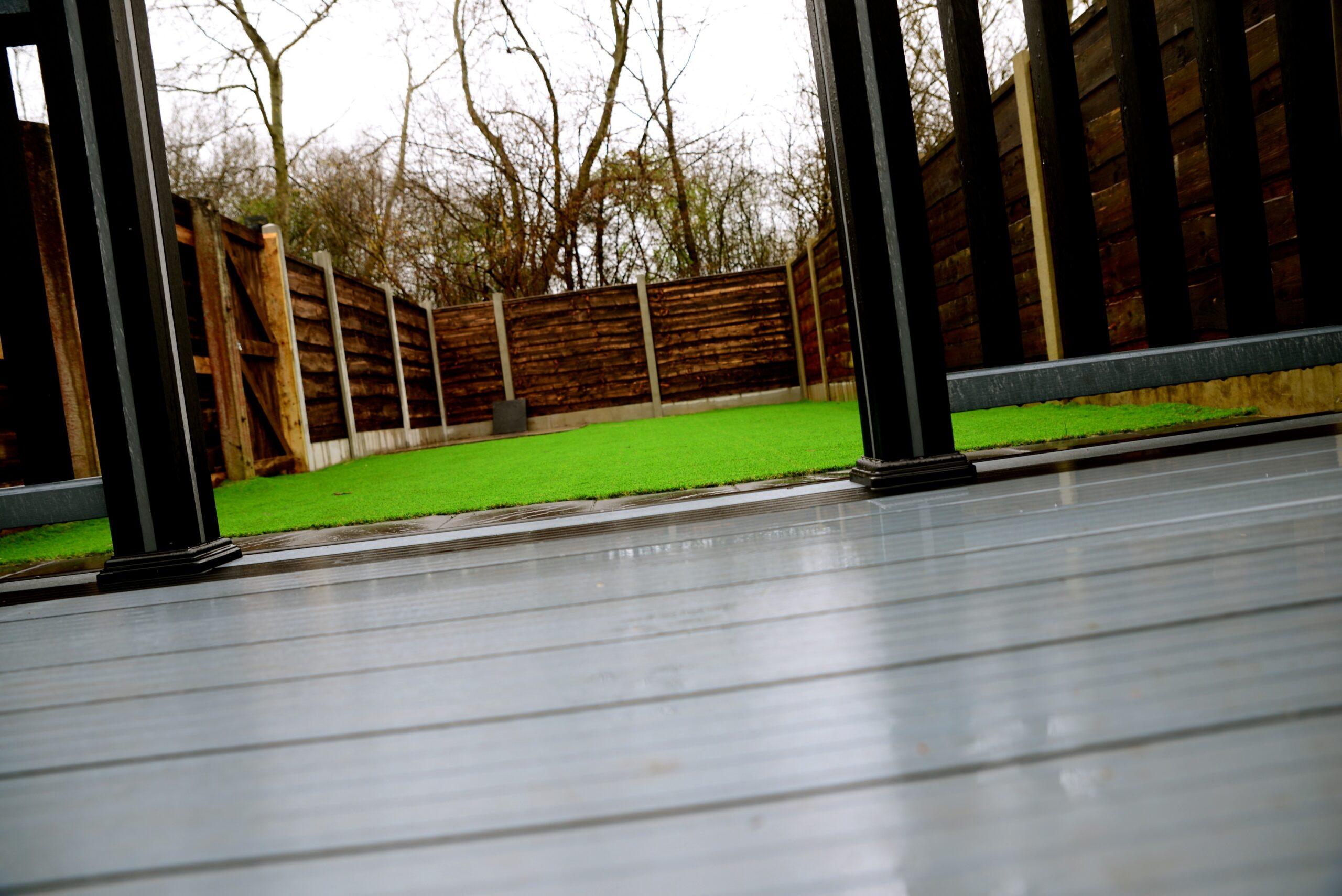 Modern Grey Decking Job With Grass